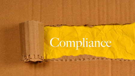 Torn Paper With Word Compliance.の写真素材