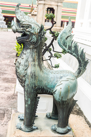Ancient statue of a lion. In the temple Thailand.の写真素材