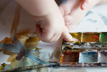 child draws paints. finger paint. closeupの写真素材