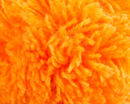 background of orange knitting yarn closeupの写真素材
