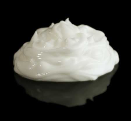 white cream on a black background closeupの写真素材