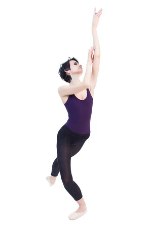 ballerina is dancing in the studio on a white background isolateの写真素材