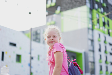 life in the city - girl posing in the street in a modern area