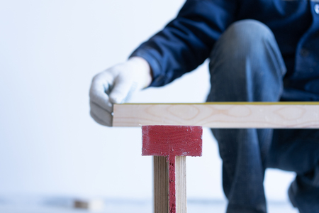 master carpenter mounts pine wood floor - eco-friendly flooring.の写真素材