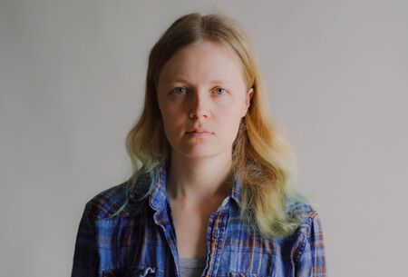 portrait of a simple serious woman without makeupの写真素材