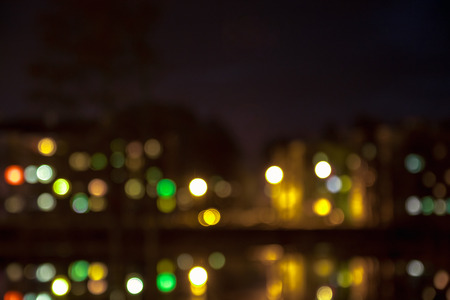 Blurred view of the town houses with night lightsの写真素材