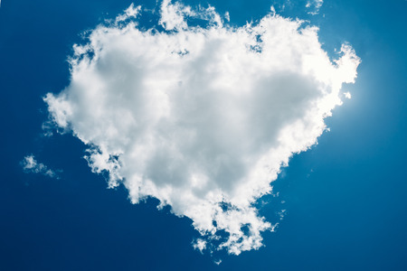 Very beautiful cumulus cloud in a blue summer sky. Cloud in the form of heart. Nobodyの写真素材