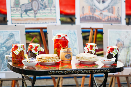 Gomel, Belarus - March 12, 2016: Traditional Belarusian snacks - tomatoes in cans and pancakesのeditorial素材