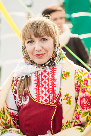 Gomel, Belarus - March 12, 2016: Woman on holiday Shrovetide in the Belarusian People's national dressのeditorial素材