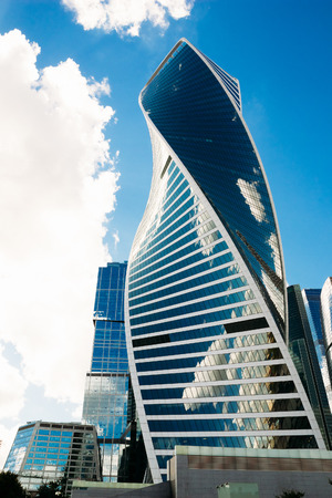 Moscow, Russia - August 16, 2016: Beautiful glass building-Evolution against the blue cloudy skyのeditorial素材