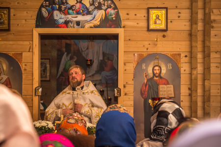 Dobrush, Belarus - May 1, 2016: The priest prays to his parishioners during Easterのeditorial素材