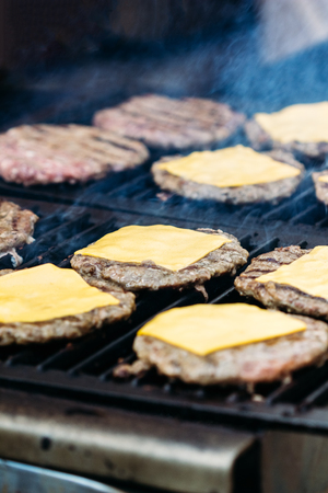 Burger meat with cheese in grilledの写真素材