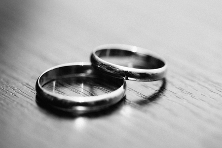 Rings of the newlyweds on the table black and white colorの写真素材