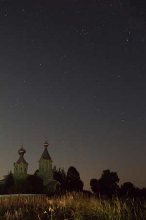Beautiful night landscape Church under the starry skyの写真素材