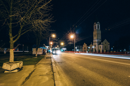 Night city road on long endurance with a church on a backgroundの写真素材