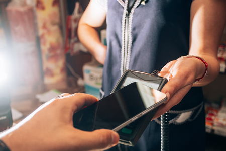 Wireless payment by smartphone concept photo