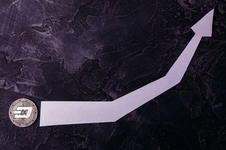 Dash of crypto currency on a dark background. Rise in the market