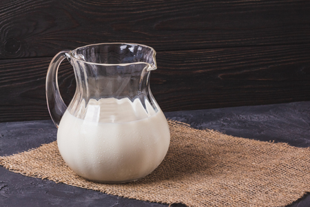 Milk in a glass jar with a copy spaceの写真素材