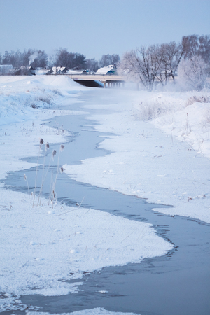 River with ice winter landscapeの写真素材