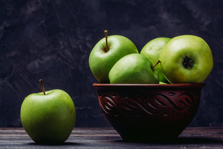 Beautiful green apples in a bowlの写真素材
