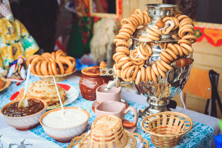 Samovar Russian with bagels on the table, jam and sour creamの写真素材