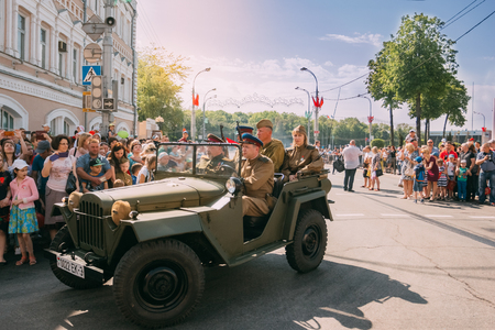 Gomel, Belarus - May 9, 2018: Red Army men in a military car passing through the intersection on Gomel Street on Victory Day, May 9のeditorial素材