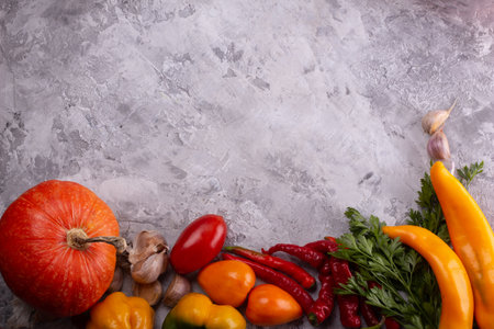 Assorted Fresh Vegetables and Herbs displayed on a stylish Gray Marble Backgroundの写真素材