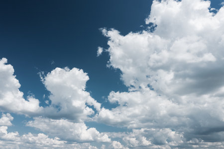A Beautiful and Picturesque Cloudy Sky Gracefully Displaying a Vibrant Blue Backgroundの写真素材
