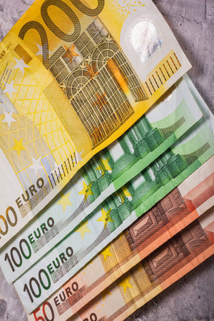 A collection of Euro banknotes in various denominations, showcasing their unique designs and differencesの写真素材