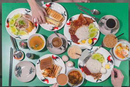 Traditional Malaysian Kopitiam breakfast set on green table. Top view, flat layの写真素材
