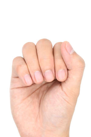 Small lunulae or half-moons at fingernails with longitudinal lines of Southeast Asian, Chinese young man. Isolated on white background.の写真素材