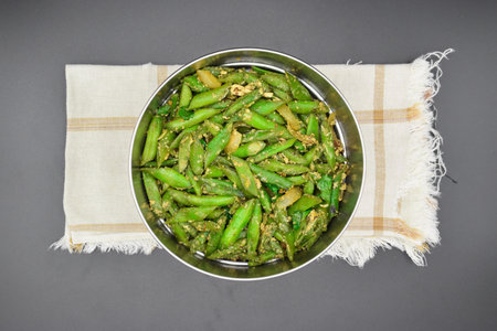 Asian, Myanmar or Burmese green bean curry recipe on napkin. Top view. Isolated on black.の写真素材