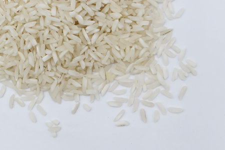 White basmati rice grain made in Myanmar, Asia. Rice is the seed of the grass species Oryza glaberrima or Oryza sativa. Closeup view. Isolated on white.の写真素材