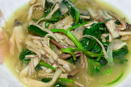 Myanmar or Burmese stir fried water spinach and mushroom curry recipe. Closeup view.の写真素材