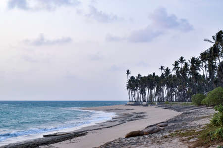 Dramatic and cool seashore under cloudy sky in Phoe Kalar Island, Chaung Thar Beach, Myanmar,...