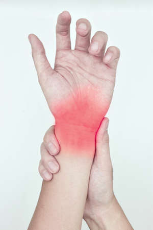 Inflammation of Asian young manâs wrist joint and hand. Concept of joint pain and hand problems. De Quervainâs tenosynovitis. Isolated on white.の写真素材