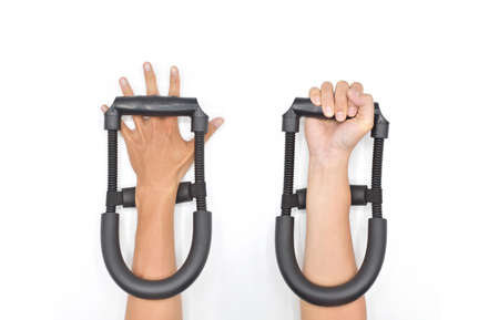 Wrist and forearm strengthener tool. Home light workout by man. Isolated on white.の写真素材