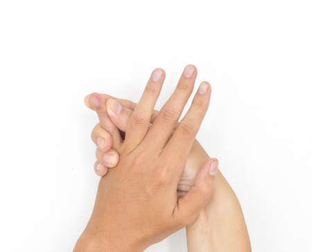 Self hand massage by Asian young man. Fingers and hand joint health. Isolated on white.の写真素材