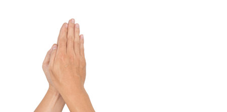 Paying obeisance posture of hands. Concept of Buddhism religion. Isolated on white.の写真素材