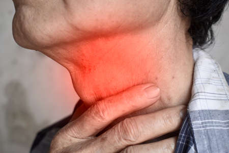 Redness at neck of Asian old man. Concept of sore throat, pharyngitis, laryngitis or dysphagia.