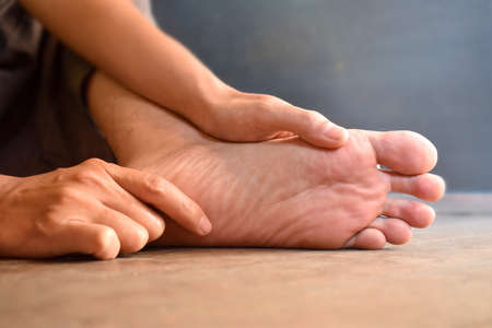 Foot of Asian young man. Concept of foot care and health.の写真素材