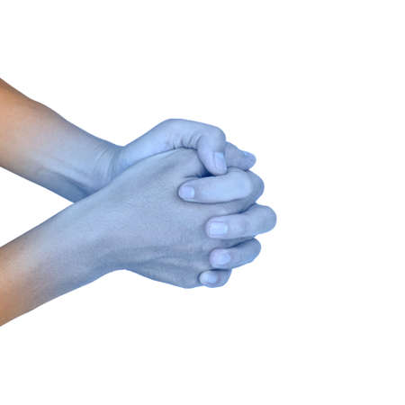 Clasped hands together with light blue color of Asian young man. Concept of cold and clumsy hand.