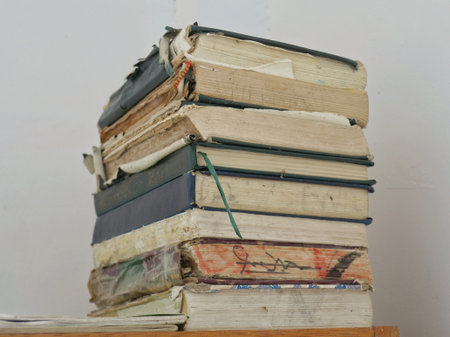 Pile of old books on a shelf in a library or universityの写真素材