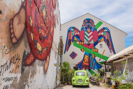 A mural artwork of an iconic character 'Mardi', a kid in a bunny outfit by Alex Face and bird robot by Rukkit in Phuket, Thailand, a famous Thai street artist.のeditorial素材