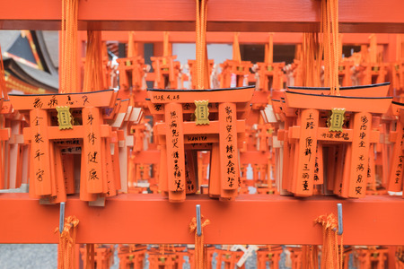 Kyoto, Japan - April 23, 2016: Ema prayer tables with unique Torii gates boards at Fushimi Inari shrineのeditorial素材
