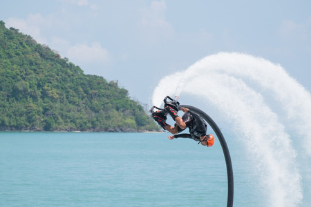 Phuket, Thailand - January 14, 2017: Showing flyboard on Ao Makham during Children's day in Phuket,...