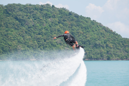 Phuket, Thailand - January 14, 2017: Showing flyboard on Ao Makham during Children's day in Phuket, Thailandのeditorial素材