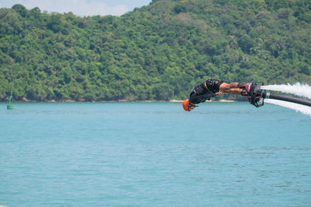 Phuket, Thailand - January 14, 2017: Showing flyboard on Ao Makham during Children's day in Phuket, Thailandのeditorial素材