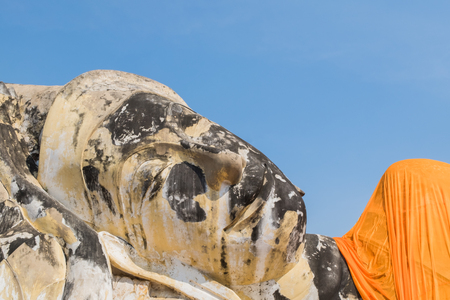 Giant Buddha reclining statue at Wat Lokayasutharam in the historical Park of Ayutthaya, Phra Nakhon Si Ayutthaya, Thailandの写真素材