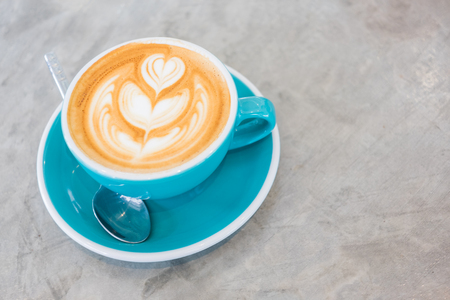 Cup of hot latte art coffeeの写真素材